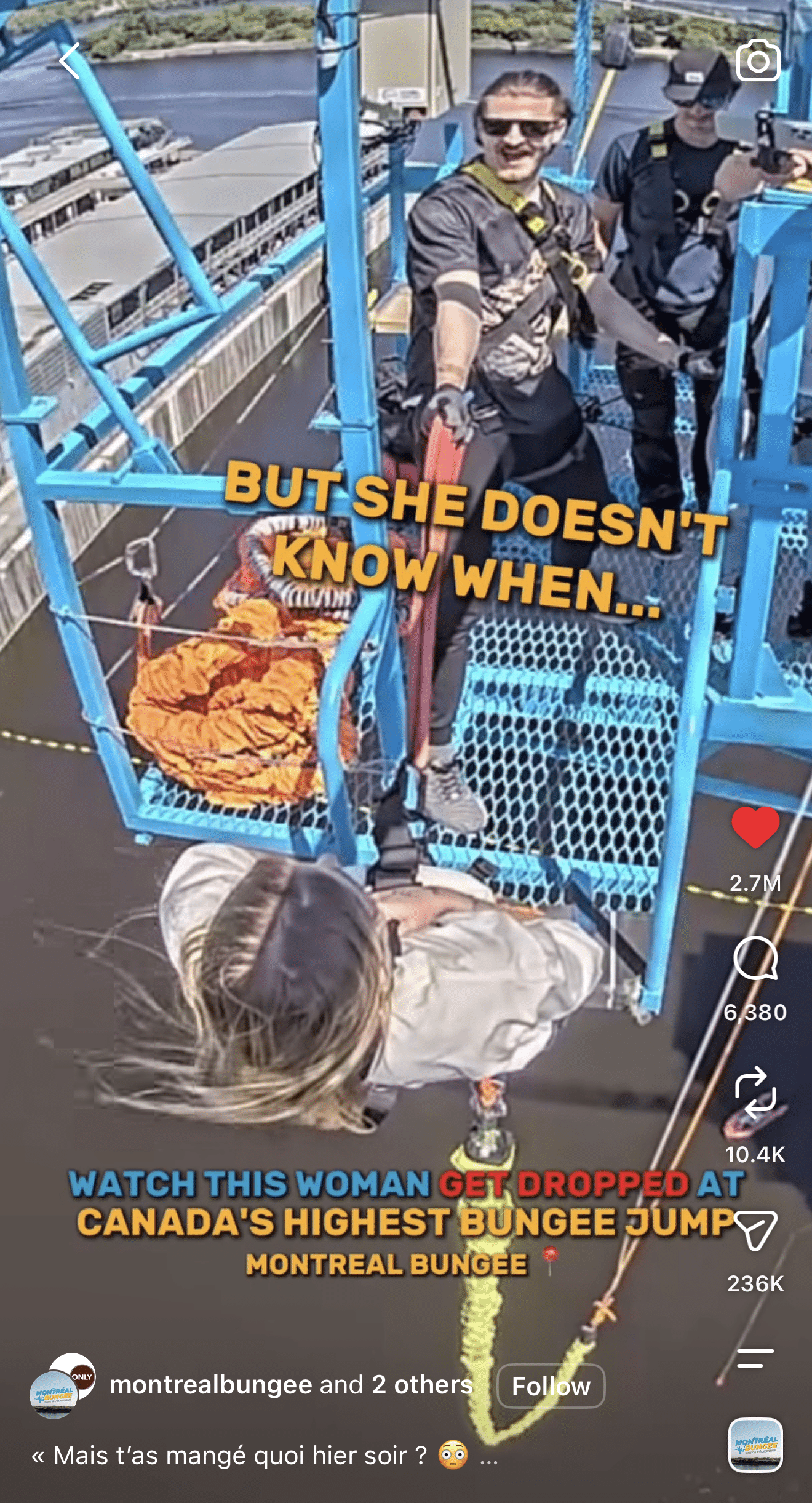 A woman in a harness stands on a blue platform, preparing to bungee jump as two instructors assist her. Text on the image says, “But she doesn’t know when...” and “Canada’s highest bungee jump.”.